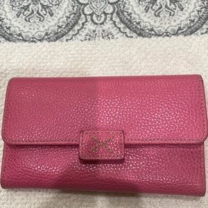 Pink leather Tusk wallet preowned.
